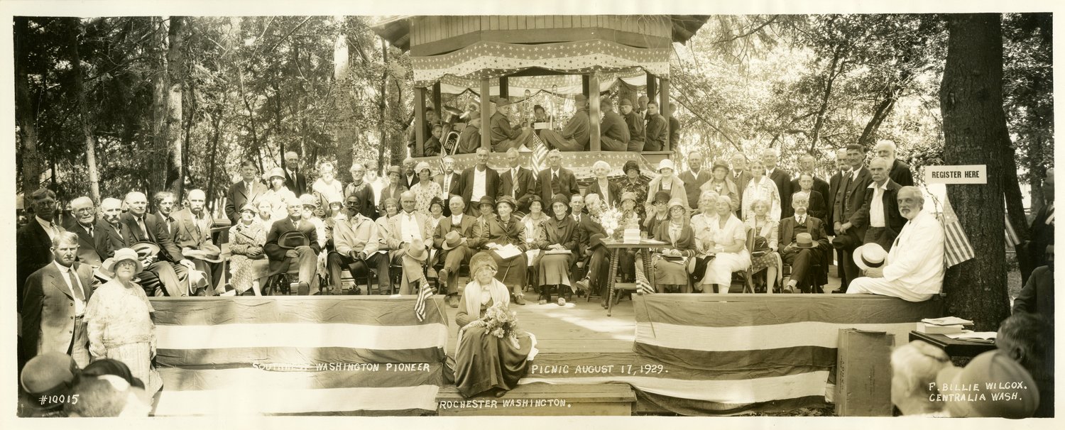 This photo is of a Southwest Washington Pioneer Picnic on Aug. 17, 1929, in Rochester. Front row center are Mr. and Mrs. A.J. Selders, from Littlerock. Mary Jane Brown (maiden name Mills) is in the center foreground of photo. She died in 1930 and was usually  “Queen of the Pioneers” at every picnic. Others pictured, according to the caption, include Henry Brown, Art Rowswell, Walter Eshom, Mr. Hemingway, James Fitzgerald, Billie Fitzgerald, Stacey Cooness, Mattie James, Elizabeth Young, Ivar Taume, Ed Pearce, Mr. and Mrs. James McCash, Rev. Miller, A.B.Townsend, Ann Hiaton, J. Sox Brown, Della Pearce, Ina French, Gus Bannse, Ada Johnson and Hermann Hoss.